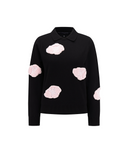 A black long-sleeve knit polo sweater featuring four light pink textured cloud appliqués on the front, displayed against a solid white background.